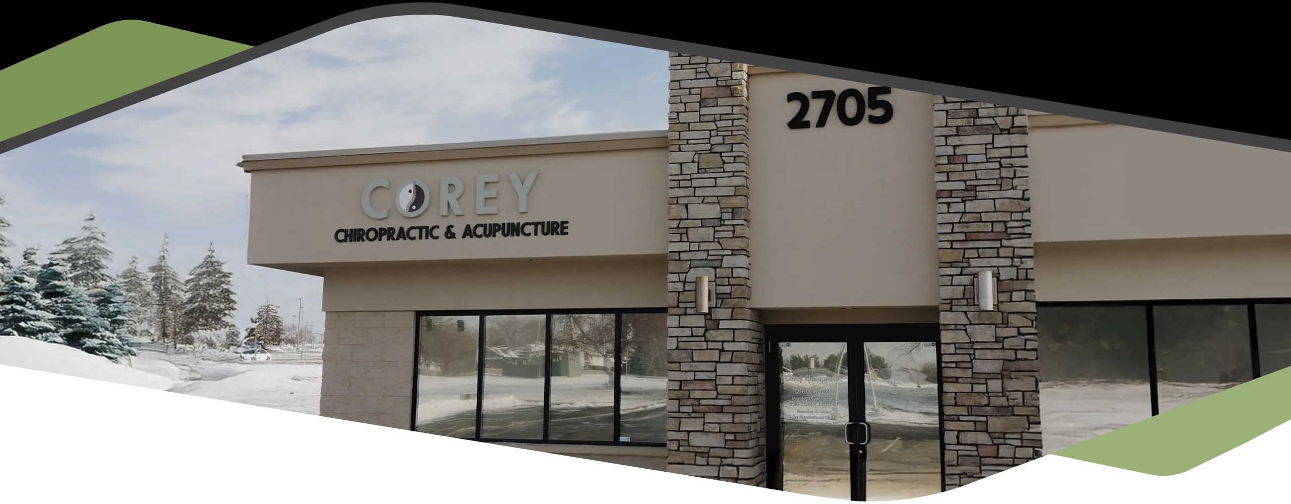 Exterior view of Corey Chiropractic & Acupuncture clinic with stone façade and visible signage.