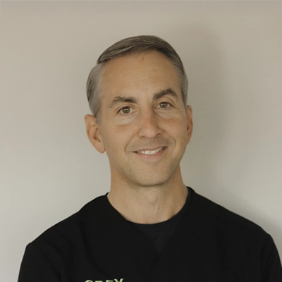 A headshot of Dr. Russell Corey, a chiropractor at Corey Chiropractic & Acupuncture P.C.